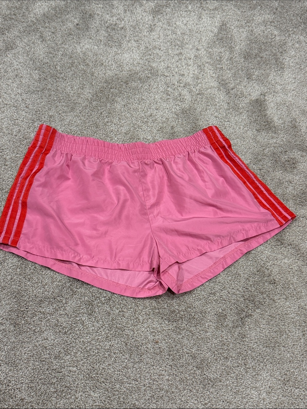 Edikted Pink Athletic Shorts with Red Side Stripes
